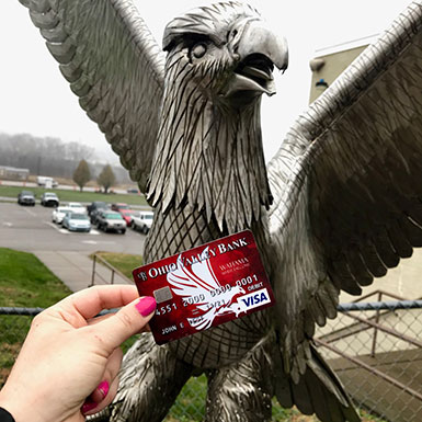 Statue of an eagle and an Ohio Valley Bank debit card