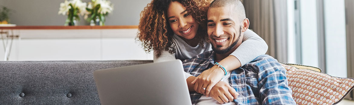 Couple using a laptop computer for online banking