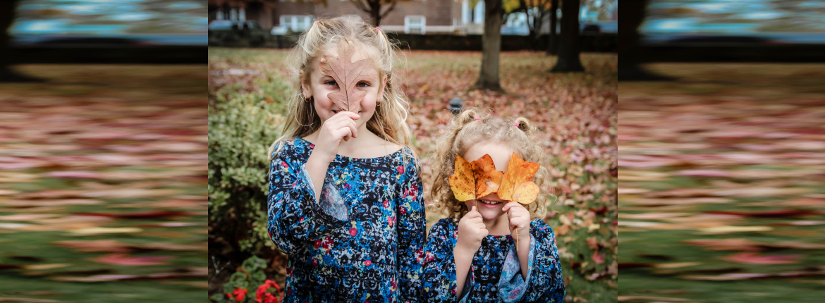 kids playing with leaves