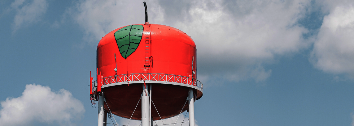 water tower painted to look like a red apple