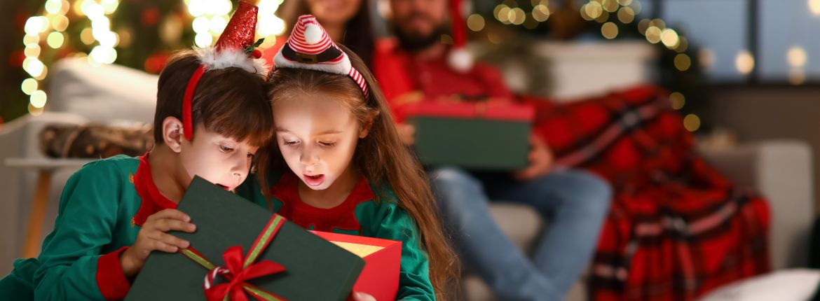 kids opening gifts at Christmas