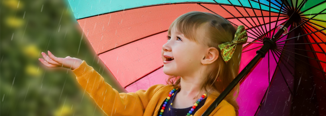 small child under an umbrella